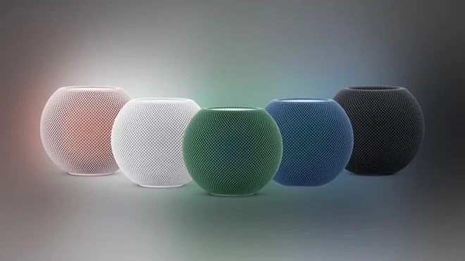 Cinco unidades do HomePod mini em cores diferentes: rosa, branco, verde, azul e cinza escuro